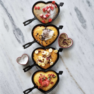 Image of product Red Rim Heart Shaped Ceramic 2-Piece Nesting Ramekins Set by Crate and Barrel