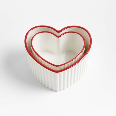 Image of product Red Rim Heart Shaped Ceramic 2-Piece Nesting Ramekins Set by Crate and Barrel
