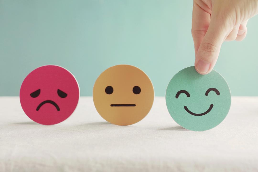 Three feedback emojis, great, average, and bad